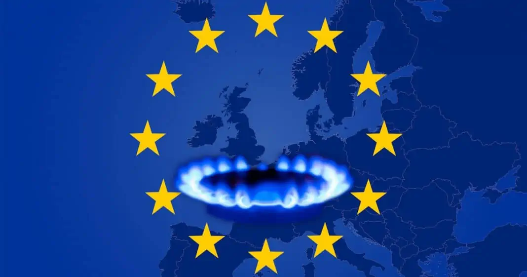 Deficit and gas crisis in Europe. Flag of the European Union with a geographic map and a burning gas stove. Copy space.